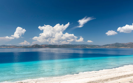 Salda Lake with its green clear water, view from the lakeside to the other sideの写真素材