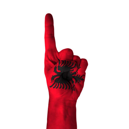Hand pointing up direction, Albania painted with flag as symbol of up direction, first and number one symbol - isolated on white backgroundの写真素材