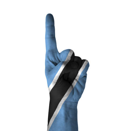 Hand pointing up direction, Botswana painted with flag as symbol of up direction, first and number one symbol - isolated on white backgroundの写真素材