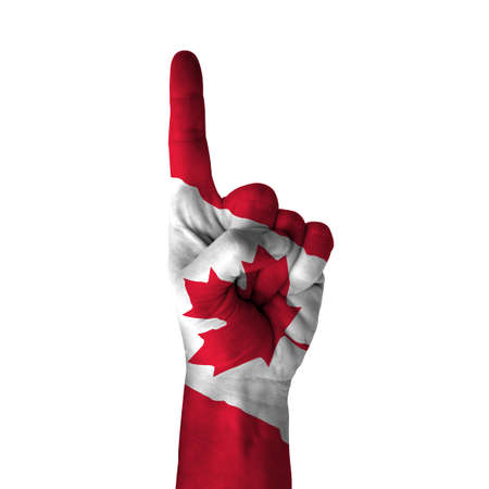 Hand pointing up direction, canada painted with flag as symbol of up direction, first and number one symbol - isolated on white backgroundの写真素材