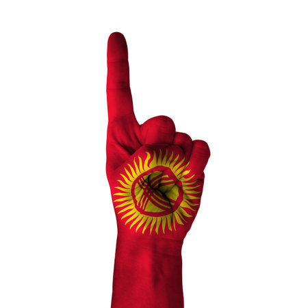 Hand pointing up direction, Kyrgyzstan painted with flag as symbol of up direction, first and number one symbol - isolated on white backgroundの写真素材