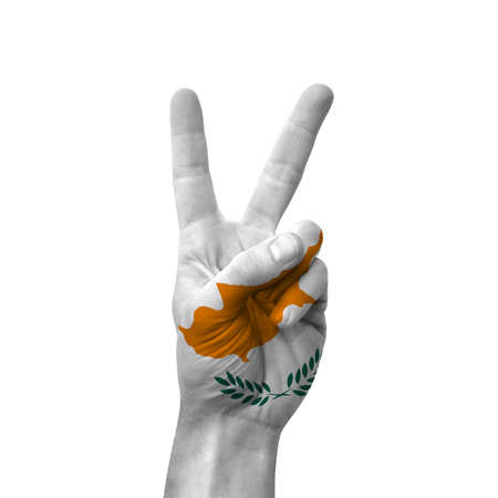Hand making victory sign, cyprus painted with flag as symbol of victory, win, success - isolated on white backgroundの写真素材