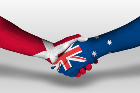 Handshake between Australia and denmark flags painted on hands, illustrationの写真素材