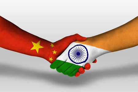 Handshake between india and china flags painted on hands, illustrationの写真素材