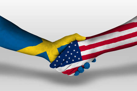 Handshake between united states of america and sweden flags painted on hands, illustrationの写真素材