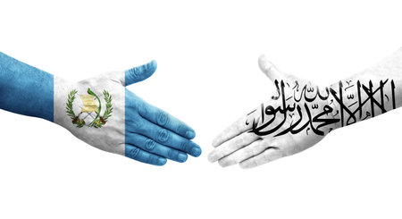 Handshake between Afghanistan and Guatemala flags painted on hands, isolated transparent image.の写真素材