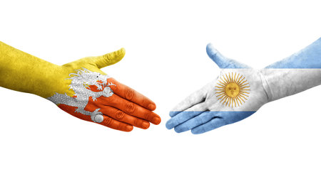 Handshake between Argentina and Bhutan flags painted on hands, isolated transparent image.の写真素材