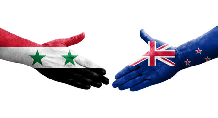 Handshake between New Zealand and Syria flags painted on hands, isolated transparent image.