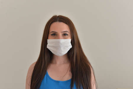 Girl is wearing mask aganist covid-19.の写真素材