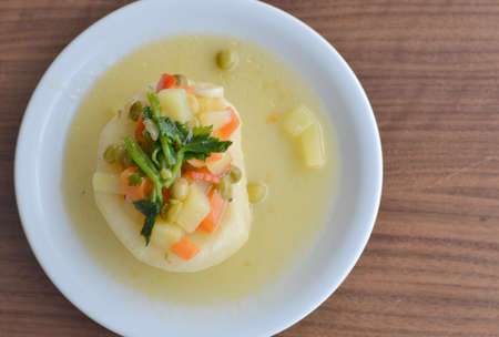 Artichoke appetizer with lemon and garnishの写真素材