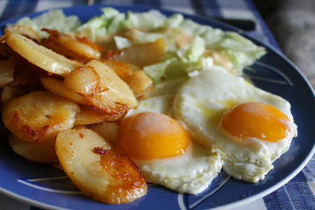 Fried potatoes and fried eggの写真素材