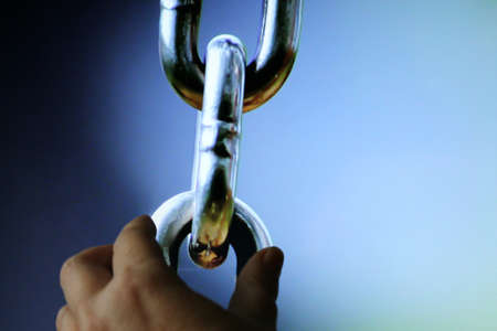 Hand pulling of chainの写真素材