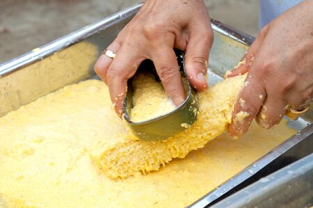 grating green corn closeの写真素材