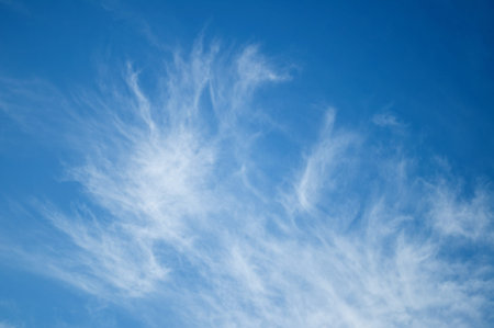 Shining blue sky with pretty white clouds