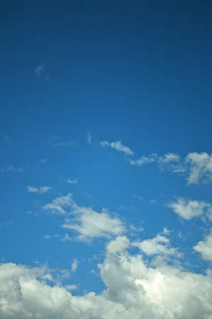 Shining blue sky with pretty cloudsの写真素材