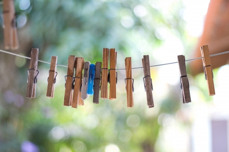 portrait clothespins hanging on the clotheslineの写真素材