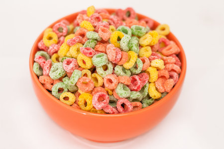 Mutil colored cereal bowl on white background. Shallow DOF.の写真素材