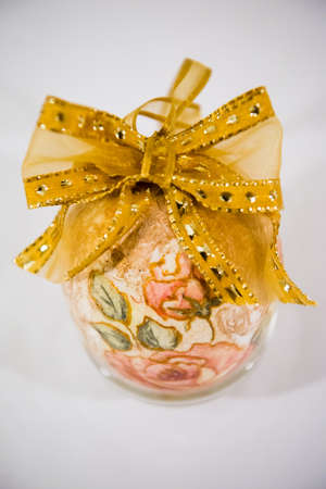 Easter egg decorated with flowers made by decoupage technique on light backgroundの写真素材