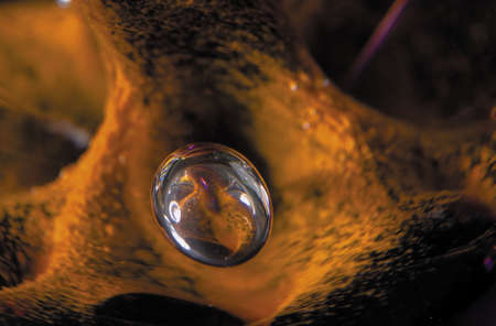 Close-up with shallow DOF of air bubble trapped in a glass paperweightの写真素材