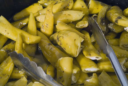 Marinaded green peppers stuffed with soft cheese and herbsの写真素材