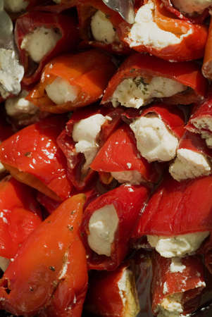 Marinaded red peppers stuffed with soft cheese and herbsの写真素材
