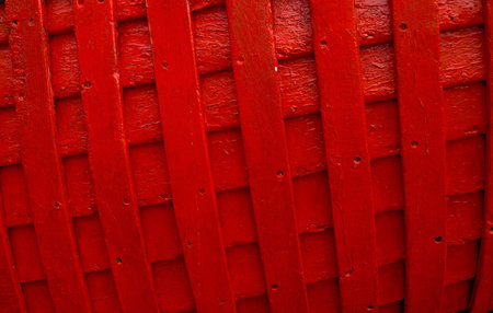 Red painted woodwork of a small boatの写真素材
