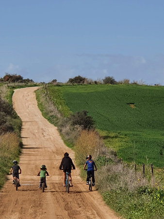boys riding their bike up a trailの写真素材