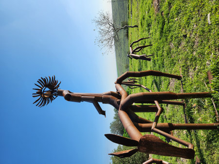 metal sculpture in the park on a background of blue sky.の写真素材