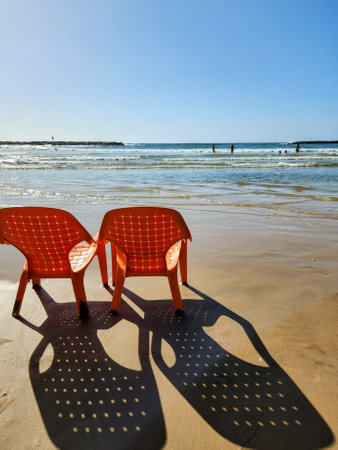 Two chairs on the beach in a sunny day. Vacation conceptの写真素材