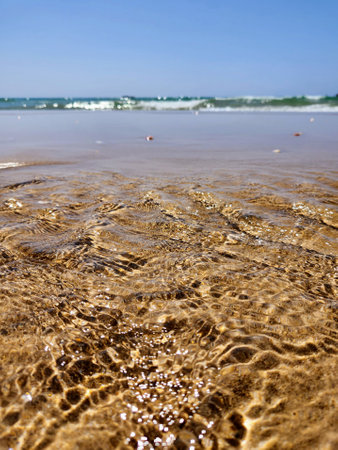 beach sand and wave in coastline sea oceanの写真素材
