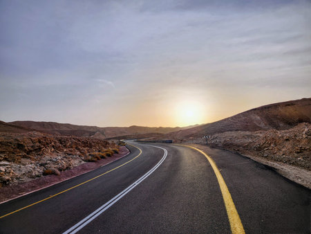 Road in the desert at sunset