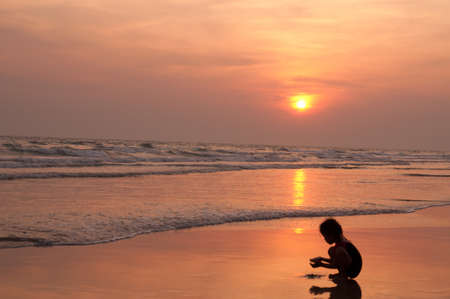 Little gril so happy at the beautiful beachの写真素材