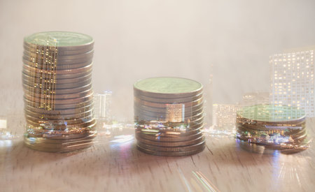 Double exposure city and rows of coins, finance and banking concept