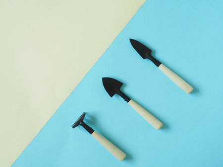 Set of different garden tools on yellow and blue background. The Duo's backgrounds.