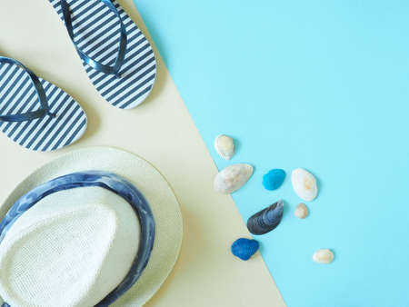 Concept of summer holidays with beach elements on a beige and blue background. The view from the top.の写真素材