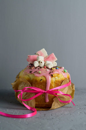 muffin with whipped cream, cake with icing on a plate