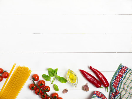 Spaghetti with tomatoes and Basil on a white wooden background. Ingredients. Healthy diet.の写真素材
