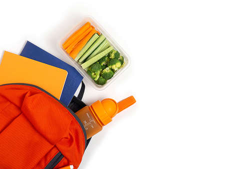 School lunch box with vegetables on a white background, top view. Flat lay.の写真素材
