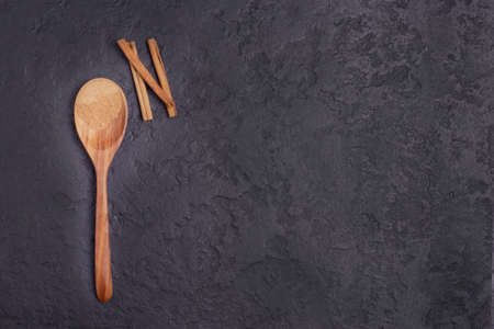 Cinnamon on a boat on a black concrete background. A copy of the space.の写真素材