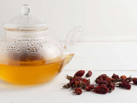 Rosehip tea on a white wooden background. Vitamin C.の写真素材