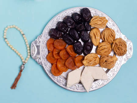 Flatley with rosaries, sweets, dates. The Concept Of Ramadan.の写真素材