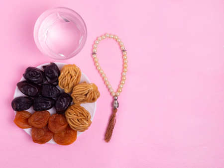 Flatley with rosaries, sweets, dates. The Concept Of Ramadan.の写真素材