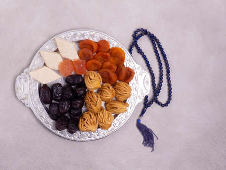 Flatley with rosaries, sweets, dates. The Concept Of Ramadan.の写真素材