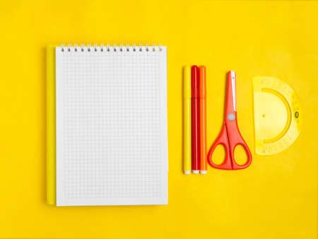 School supplies on an orange background. School concept, office supplies. A copy of this place.の写真素材