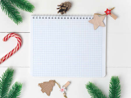 Christmas holiday background with board and decorations, gift boxes on the gray textured board View from aboveの写真素材