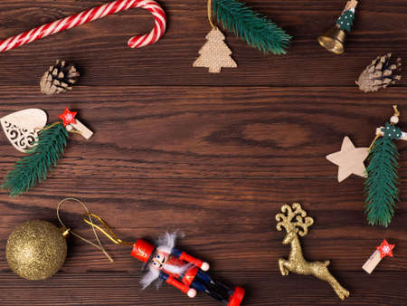 Christmas holiday background with Board and decorations, gift boxes on dark wooden background, top viewの写真素材