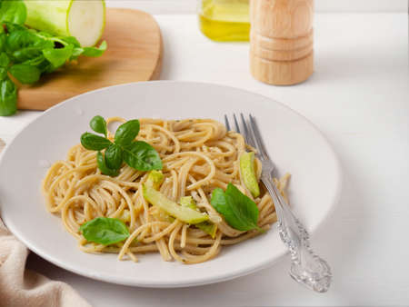 Pasta with pesto sauce, basil and zucchini.の写真素材