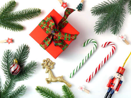 Christmas holiday background with board and decorations, gift boxes on the gray textured board View from aboveの写真素材