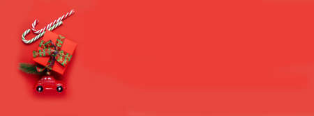 Car, gift, lollipop, candy on a red background.の写真素材