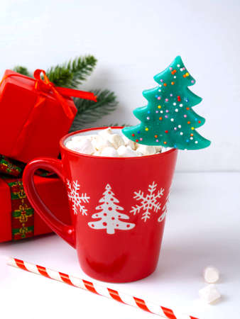 Red mug with hot chocolate with marshmallows.の写真素材